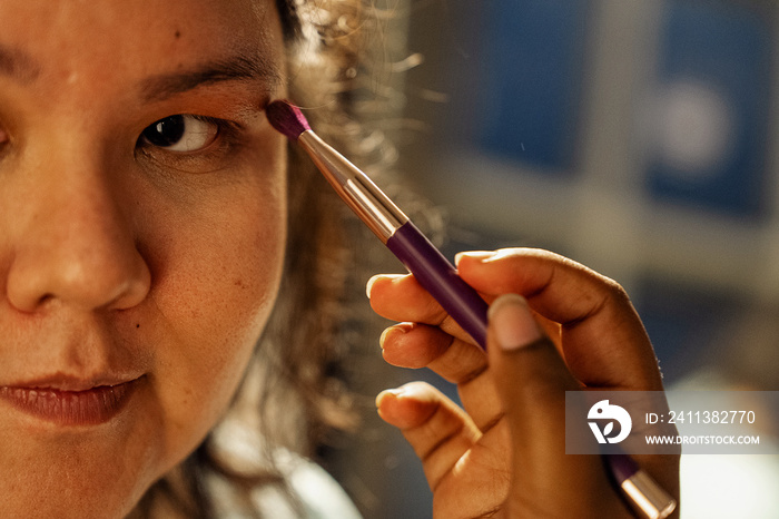 Group of friends doing each others make up at home during a sleepover