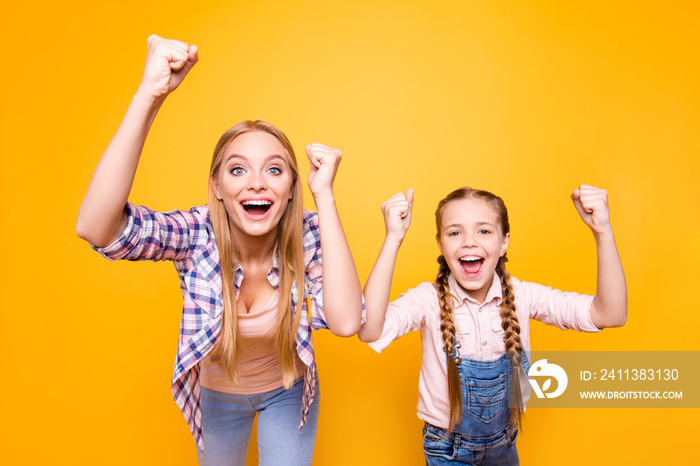 Yeah yes wow cool! Dreams come true! Different age face siblings mama mom mum mommy concept. Portrait of excited crazy joyful amazed cheerful girls with long hair isolated on bright vivid background