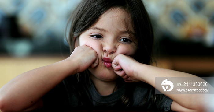 Upset child sad small girl crossing arms unhappy kid