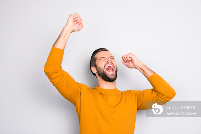 People leadership wonderment concept. Portrait of cheerful excited joyful careless handsome attractive delightful yelling shouting guy isolated on gray background