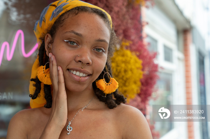 Portrait of young woman looking at camera