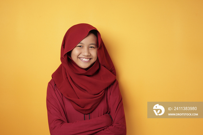 Asian Muslim Teenage Girl Wearing Hijab Smiling at Camera