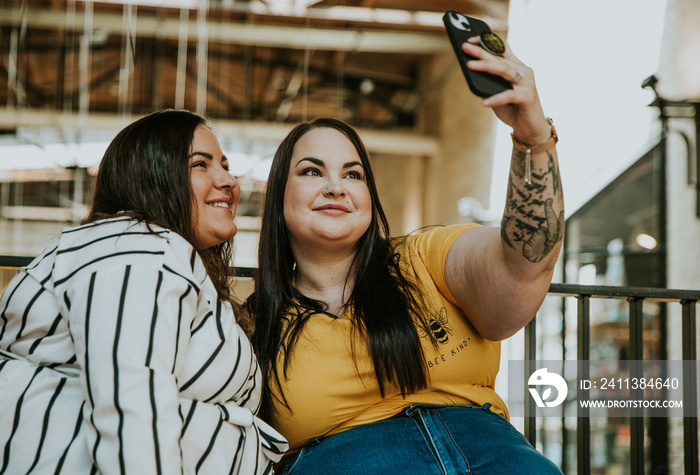 closeup of 2 women taking a selfie