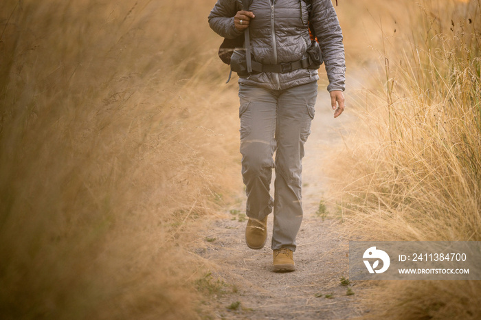 U.S. Army female soldier putting in the miles with an early morning hike in the NorthWest.