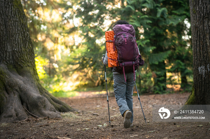 U.S. Army female soldier putting in the miles with an early morning hike in the NorthWest.