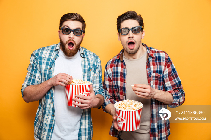 Portrait of a two astonished young men in 3d glasses