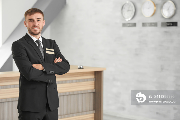 Male hotel receptionist at workplace