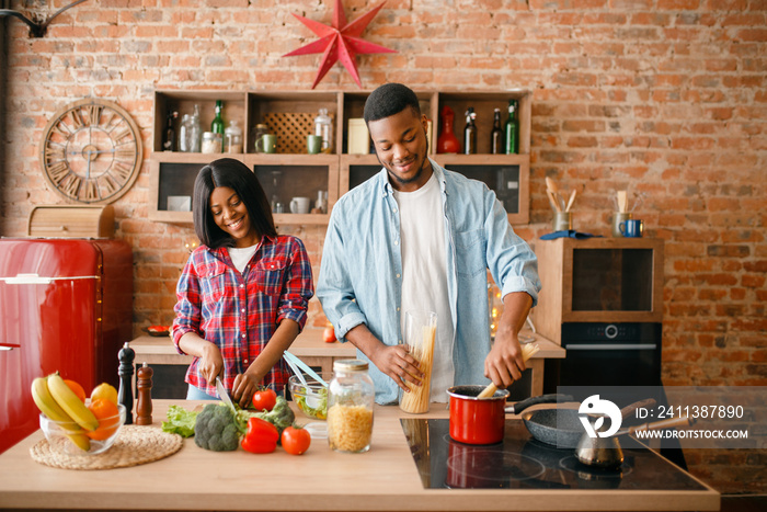 Black love couple cooking romantic dinner