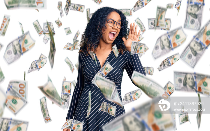 Young african american woman wearing casual clothes and glasses shouting and screaming loud to side with hand on mouth. communication concept.