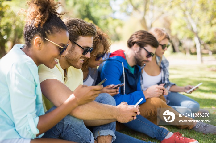 Group of friends using mobile phone