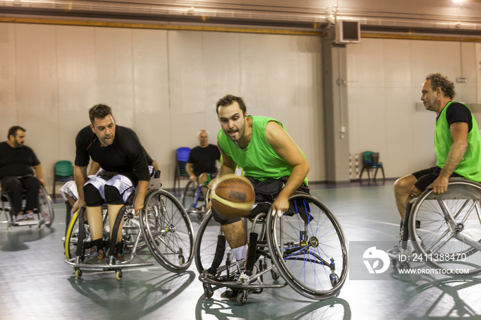 disabled sport men in action while playing indoor basketball