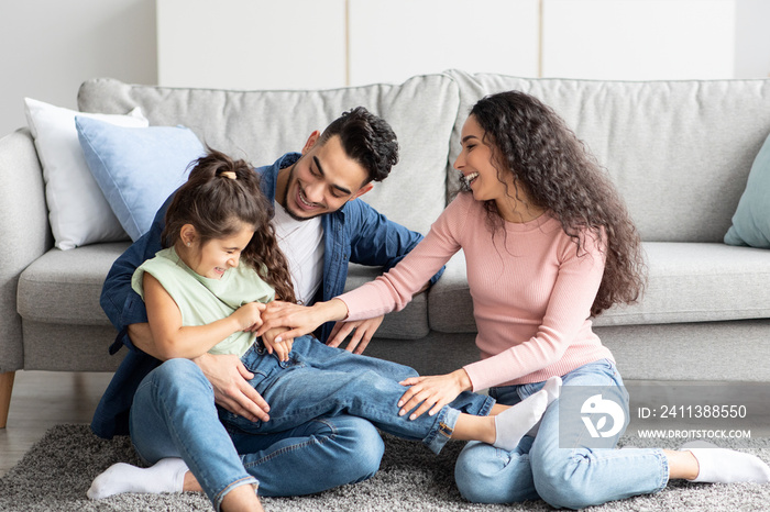 Portrait Of Happy Arab Family Spending Time Together At Home