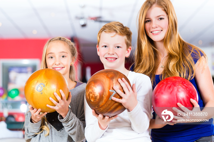 Children Friends playing together at bowling center