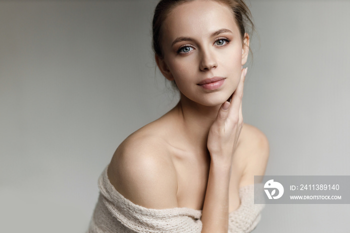 Portrait of a young pretty woman indoor in studio, skin wellness