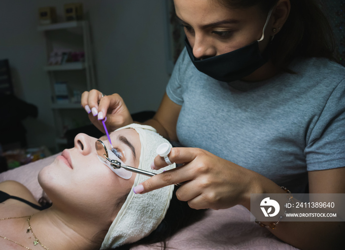 Young woman receiving natural eyelash lift treatment