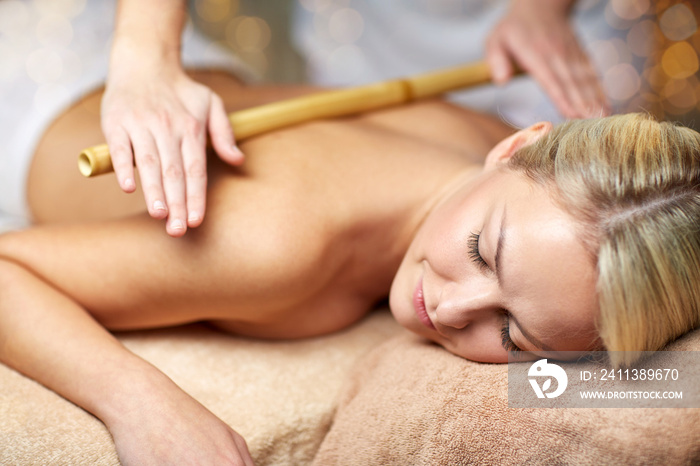 close up of woman lying and having massage in spa