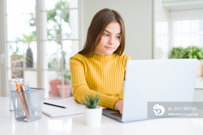 Beautiful young girl studying for school using computer laptop with a confident expression on smart face thinking serious