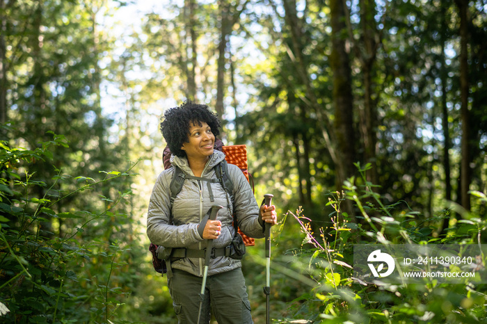 U.S. Army female soldier putting in the miles with an early morning hike in the NorthWest.