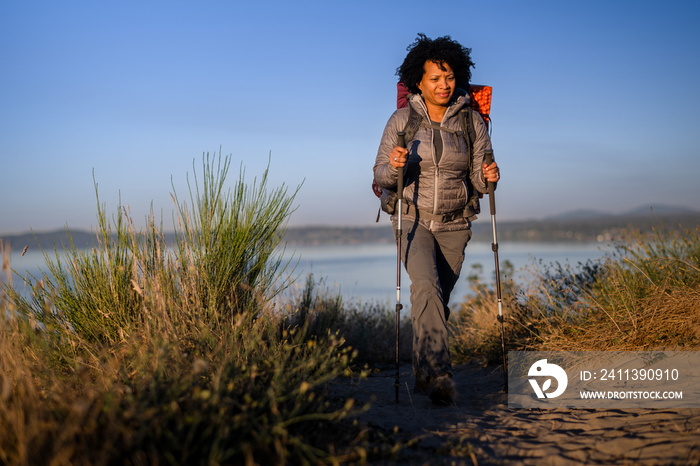 U.S. Army female soldier putting in the miles with an early morning hike in the NorthWest.