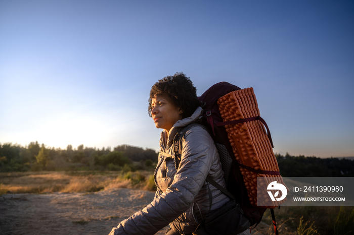 U.S. Army female soldier putting in the miles with an early morning hike in the NorthWest.