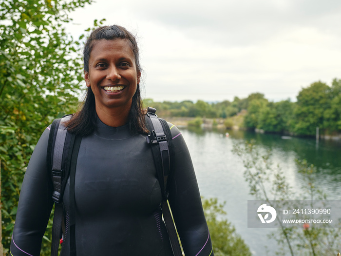 Portrait of smiling woman in wetsuit