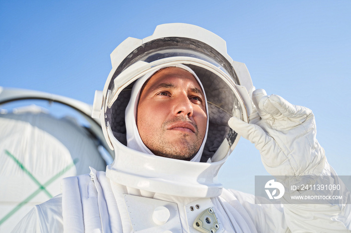 Male astronaut in space suit