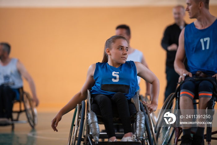 a young woman playing wheelchair basketball in a professional team. Gender equality, the concept of sports with disabilities.