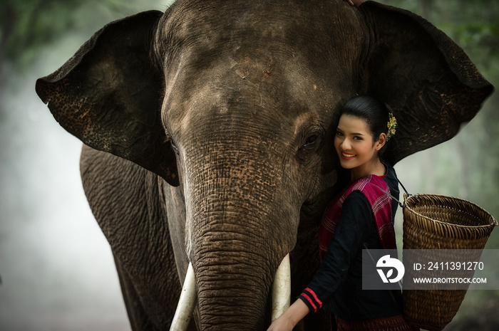 The woman and elephant portrait concept she enjoying in Thailand