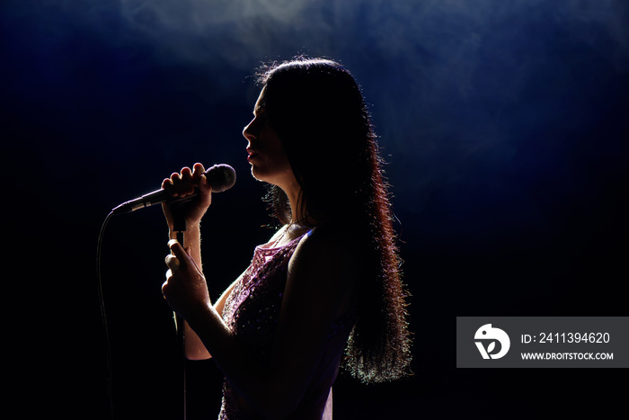 Shadow of singer in light