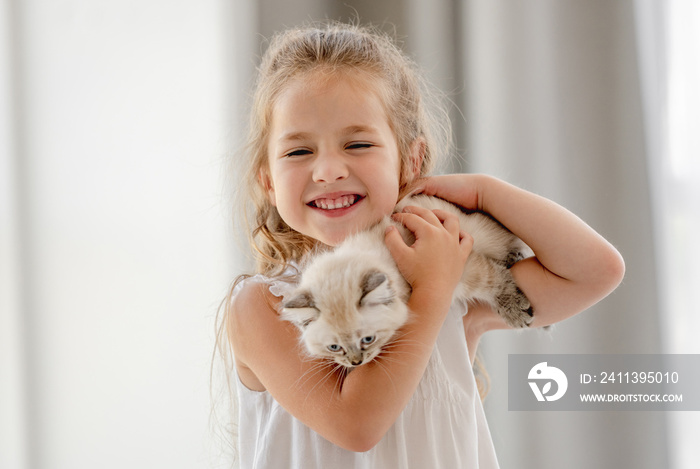 Girl with ragdoll kitten