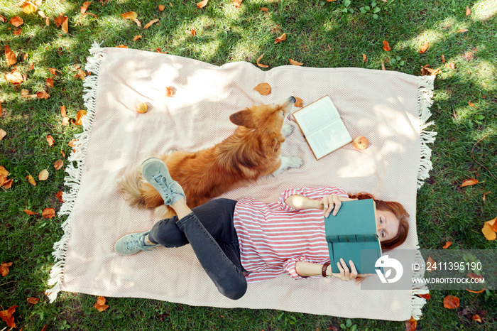 girl and dog on a lawn