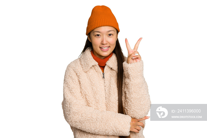 Young asian woman wearing winter clothes isolated on green chroma background showing number two with fingers.