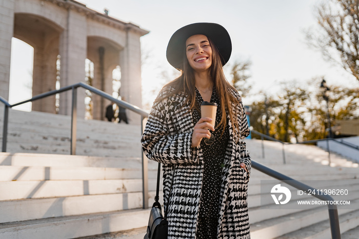 attractive young woman walking in autumn wearing coat