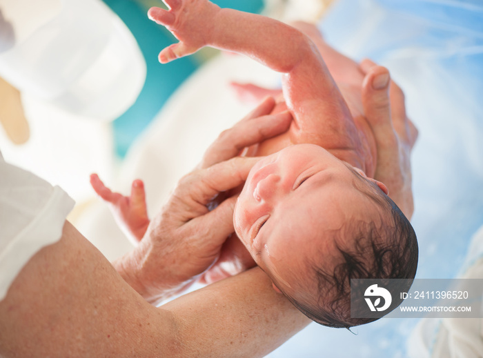 Newborn baby first bath