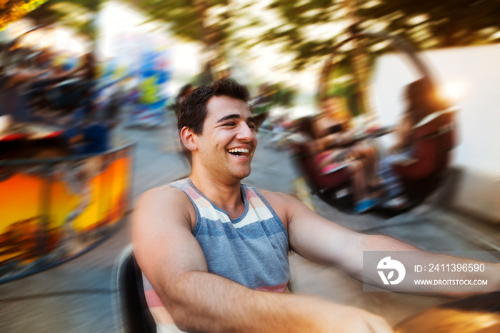 Man enjoying carousel in amusement park