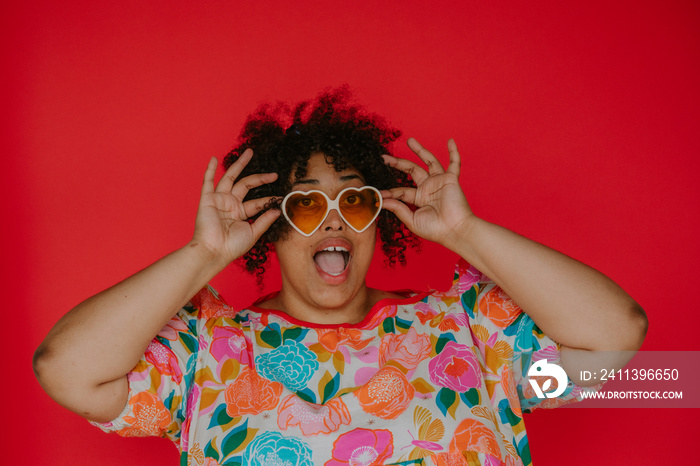 portrait of a plus size black person with surprised expression