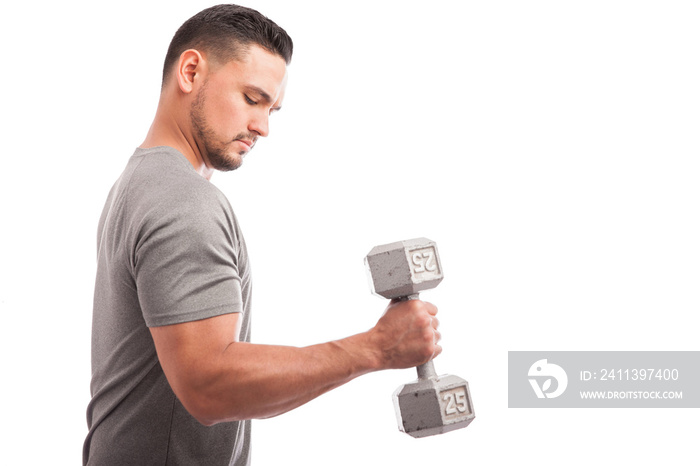 Young man lifting weights