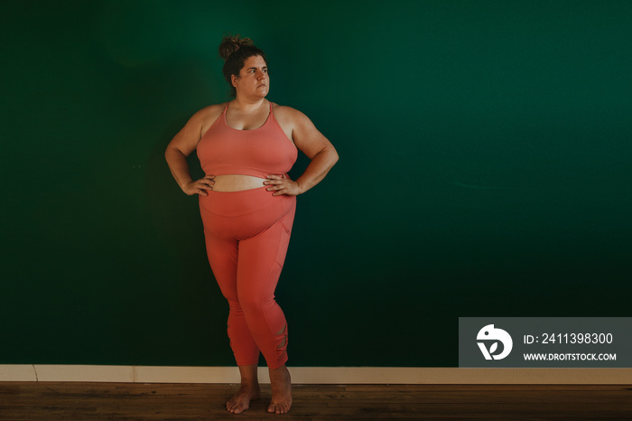 portrait of a plus size woman in workout gear