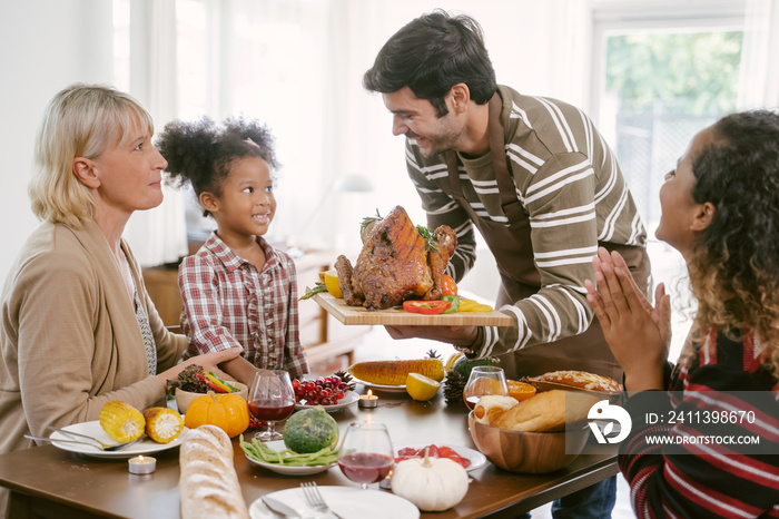 Happy Family Celebrating Thanksgiving Dinner at home . Celebration tradition concept