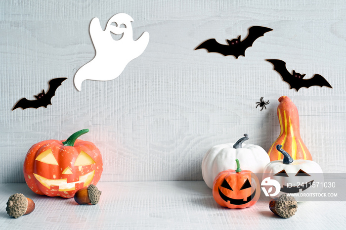 Halloween decorations on pastel gray background. Halloween concept. Pumpkin, bat, spider and ghost.