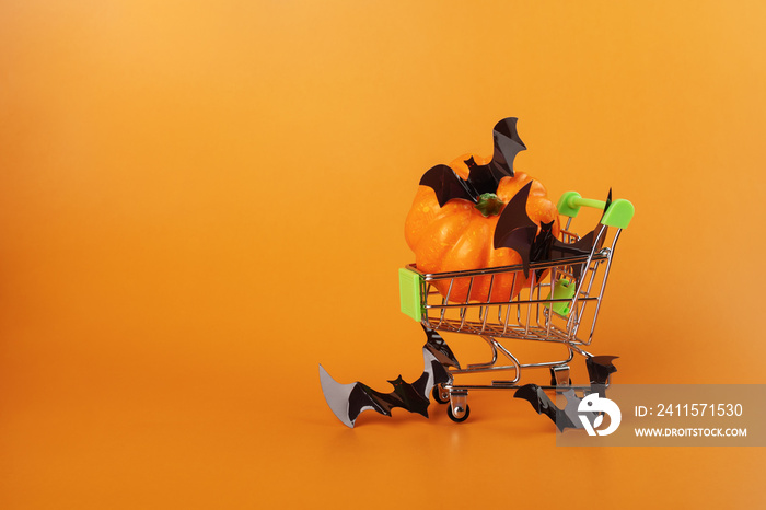 halloween sale, shopping cart with halloween decoration on orange background, Happy Halloween,holida