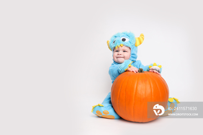 Baby dressed up for Halloween in a monster costume