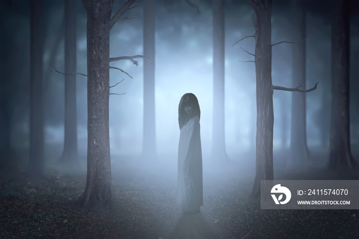Scary ghost woman with blood and dirty face standing in the haunted forest with fog and moonlight