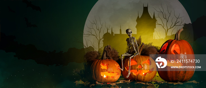 Carved Halloween pumpkins with skeleton on dark background