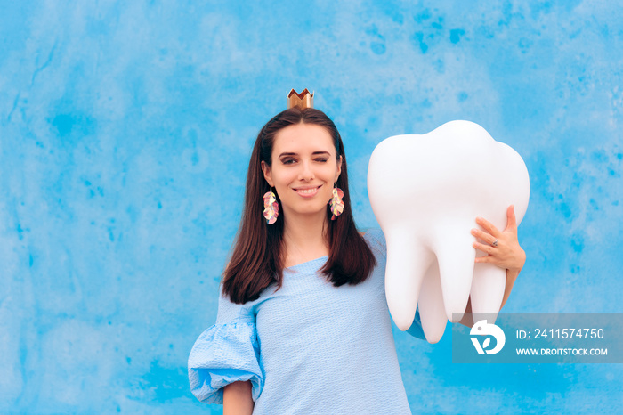 Woman in Tooth Fairy Costume Holding Big Molar