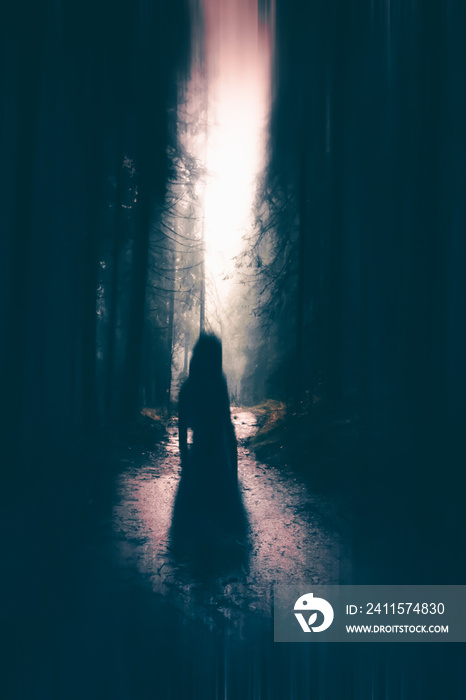 Horror halloween concept. strange silhouette in a dark spooky forest at night