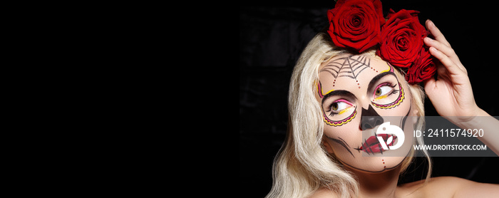 Halloween Make-Up Style. Blond Model Wear Sugar Skull Makeup with Red Roses. Dia de los Muertos or S