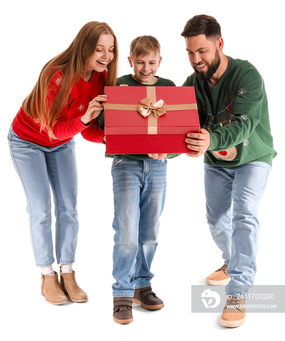 Happy parents with their little son opening Christmas present on white background