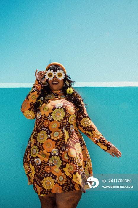 plus size Black woman with sunflower sunglasses