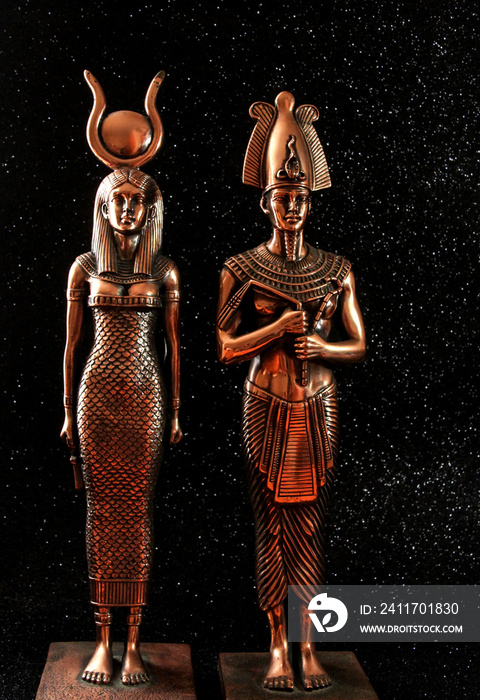 Pharaoh Tutankhamun with the goddess ISIS on a black background. Egyptian history.